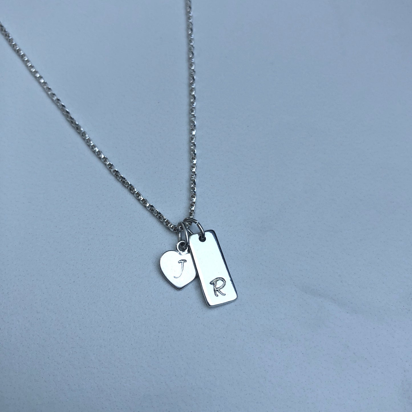 Vertical bar initial charm