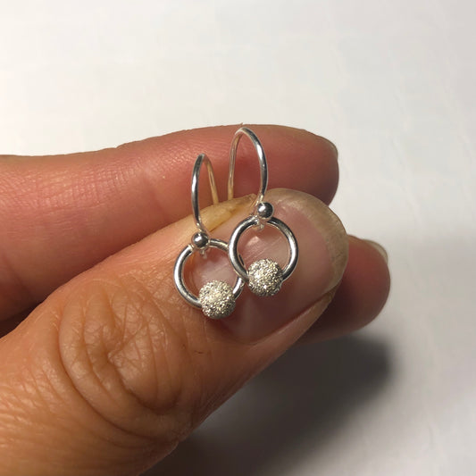 Dainty stardust silver earrings