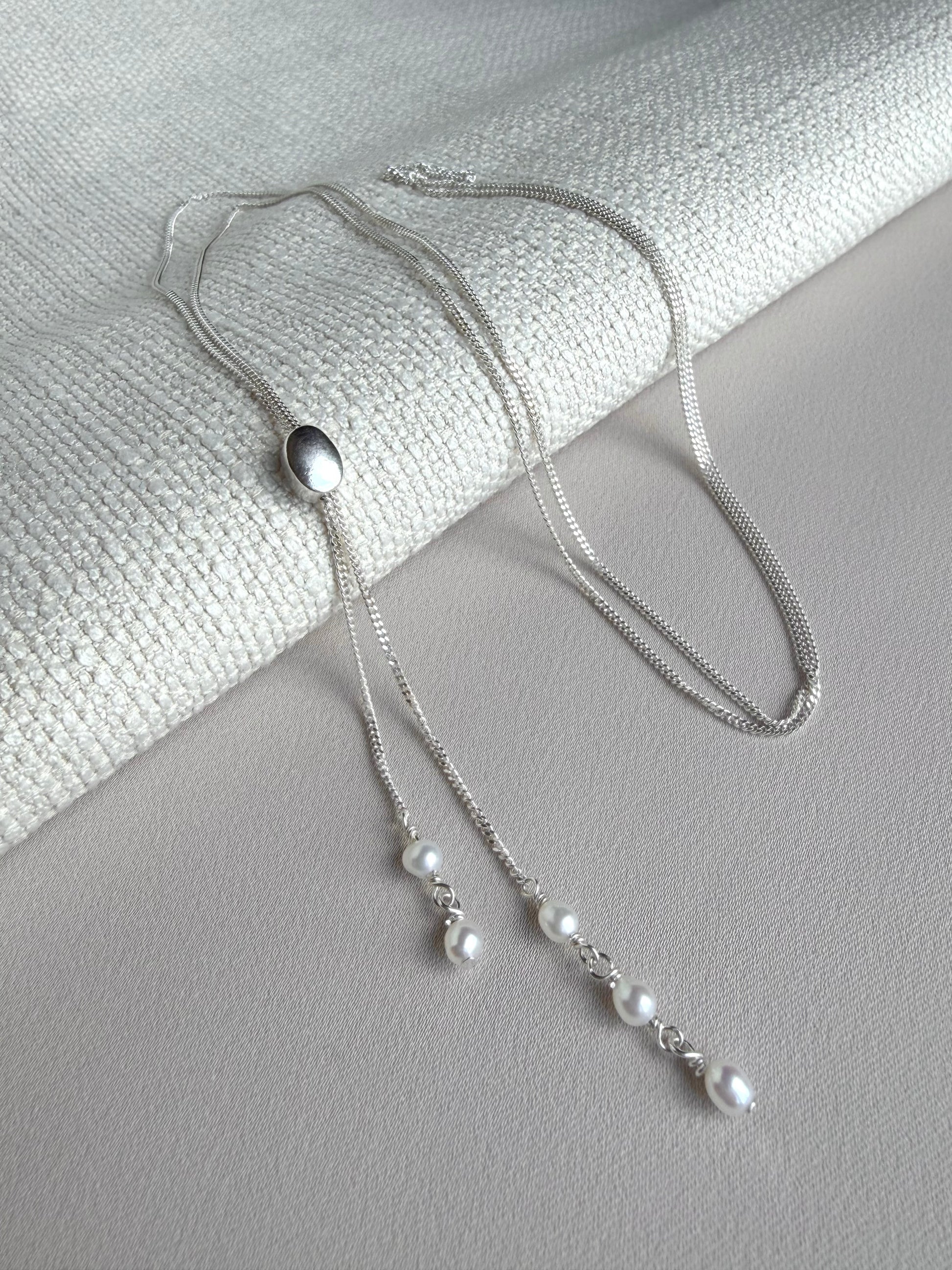 Freshwater pearl slider necklace in bolo necklace style with freshwater pearls and sterling silver